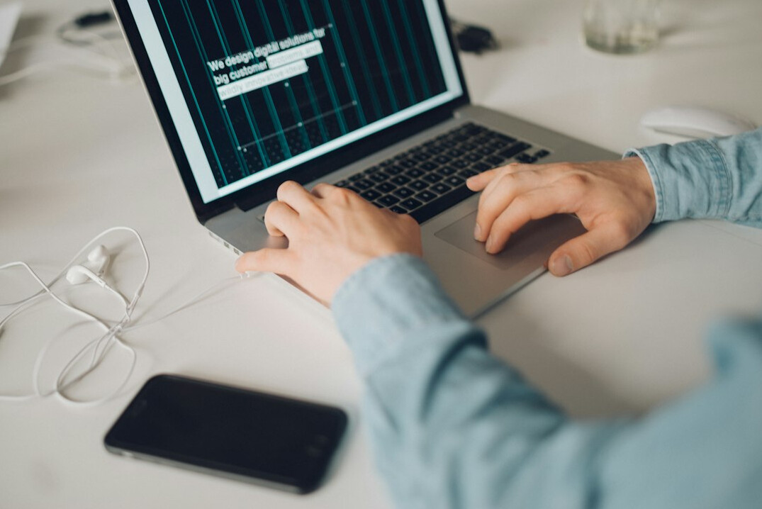 person analyzing charts on laptop