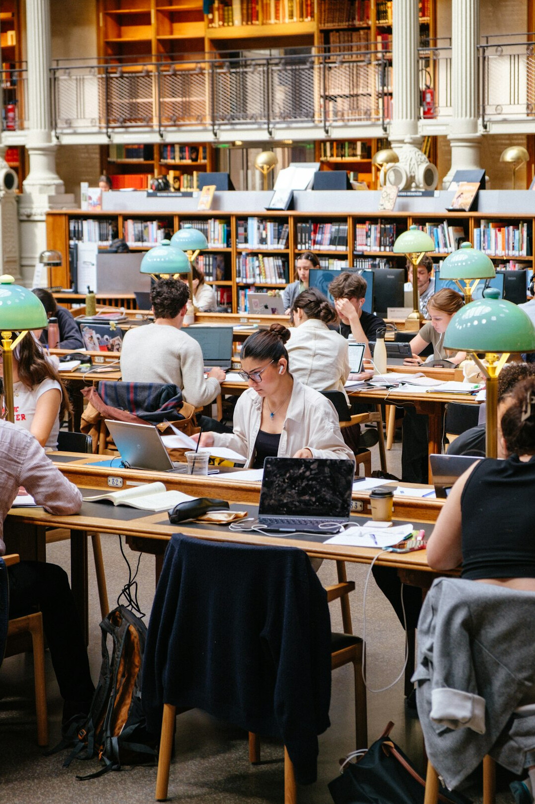 person reading book at desk